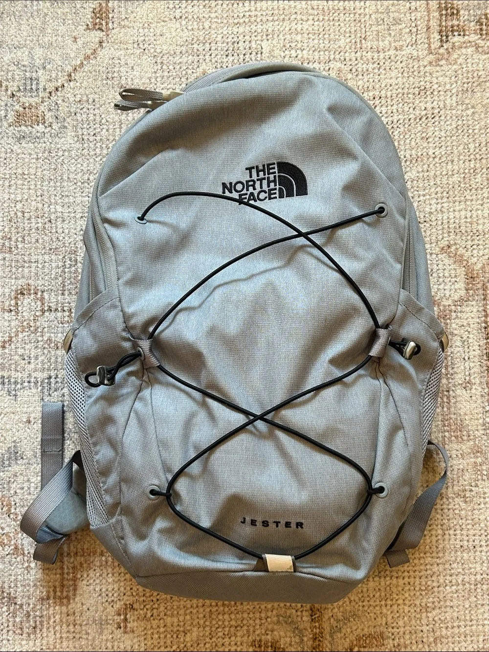 The North Face Jester Backpack in Light Gray with Black Bungee